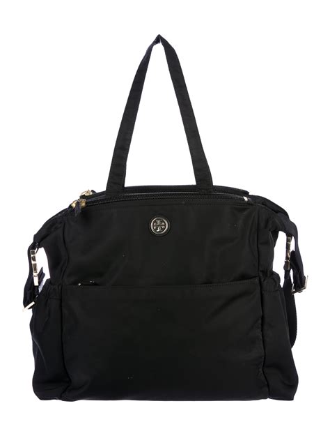 Authentic Tory Burch baby bag with multiple pockets and compartments. . Tory burch diaper bag